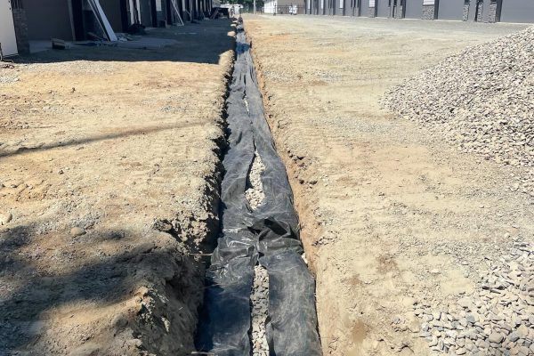 A utility trench in a Vernon BC neighbourhood by Platinum Ridge Earthworks