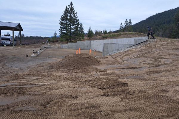 Slope stabilization on a Platinum Ridge Earthworks job site using a concrete wall