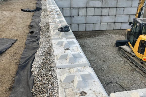 A large retaining wall on a Platinum Ridge Earthworks jobsite in Vernon BC